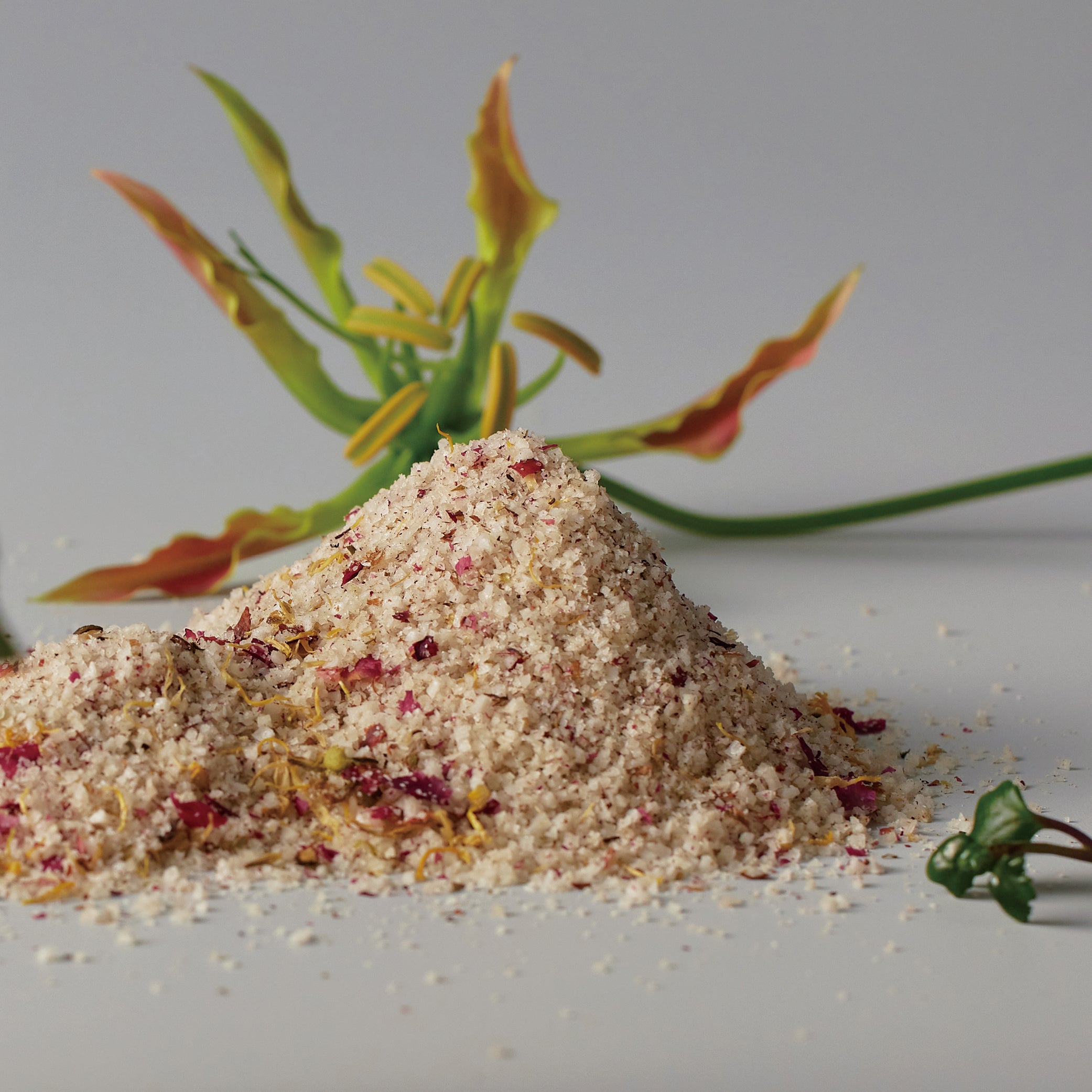 ReSaltZ Aroma Bath Salts mixed with dried flower petal